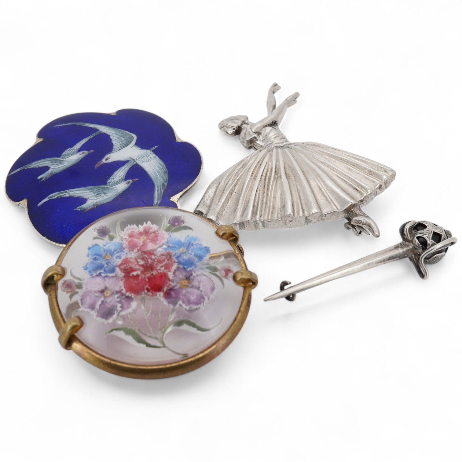 An early to mid 20th century Norwegian 925S and two colour enamelled, brooch, by Ole Nicolai Olberg, depicting three seagulls, 51mm, together with a silver ballerina brooch by D H Phillips Ltd, Birmingham, 1947, a sterli